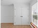 Stylish white double closet doors with black hardware complement the interior at 4317 Mccullough St, Port Charlotte, FL 33948