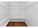 Walk-in closet with wood floor and wire shelves for optimal storage at 4317 Mccullough St, Port Charlotte, FL 33948