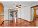 Dining room with hardwood floors, decorative wall trim, and access to the outdoor patio at 4317 Mccullough St, Port Charlotte, FL 33948
