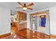 Open dining area with hardwood floors, built-in cabinets, and sliding glass doors to the patio at 4317 Mccullough St, Port Charlotte, FL 33948