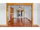 Elegant dining room with hardwood floors, cabinet, and sliding glass door to the outdoors at 4317 Mccullough St, Port Charlotte, FL 33948