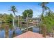 Dock with a boat lift and a serene waterfront setting at 4317 Mccullough St, Port Charlotte, FL 33948