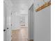 Bright hallway features neutral tile flooring and white trim throughout the property at 4317 Mccullough St, Port Charlotte, FL 33948