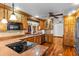 Gourmet kitchen boasting custom wood cabinets, granite countertops, and stainless steel appliances at 4317 Mccullough St, Port Charlotte, FL 33948