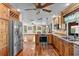 Modern kitchen featuring stainless steel appliances, hardwood floors, and granite countertops at 4317 Mccullough St, Port Charlotte, FL 33948
