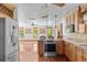Spacious kitchen offering stainless steel appliances, hardwood floors, and granite countertops at 4317 Mccullough St, Port Charlotte, FL 33948