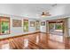 Spacious living room boasts gleaming hardwood floors and large windows for natural light at 4317 Mccullough St, Port Charlotte, FL 33948