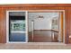 Elegant living room with hardwood floors viewed through sliding glass doors from the patio at 4317 Mccullough St, Port Charlotte, FL 33948
