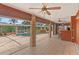 Inviting screened-in pool area with brick pillars, beautiful waterfall feature, and lush surroundings at 4317 Mccullough St, Port Charlotte, FL 33948