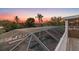 Aerial view of a beautiful screened-in pool and spa area at sunset with palm trees at 4317 Mccullough St, Port Charlotte, FL 33948