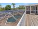 An elevated view overlooking the pool with a screened-in enclosure and patio at 4317 Mccullough St, Port Charlotte, FL 33948