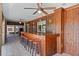 Charming poolside bar with wood accents, seating for six, and ceiling fans at 4317 Mccullough St, Port Charlotte, FL 33948