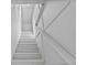 Image of a white painted wooden staircase with handrail leading to the upper level at 4317 Mccullough St, Port Charlotte, FL 33948