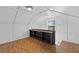 Upper level with patterned wood floor, neutral walls, overhead lighting, and a built-in shelf at 4317 Mccullough St, Port Charlotte, FL 33948