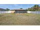 Spacious backyard with a white fence and a covered, screened patio at 4358 Pates St, Port Charlotte, FL 33948