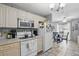 Cozy kitchen with an eat-in dining area and white appliances at 4358 Pates St, Port Charlotte, FL 33948