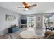 Open concept living room with bright grey walls, tile floor, and backyard access at 4358 Pates St, Port Charlotte, FL 33948