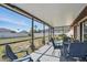Screened-in patio with seating, offering views of the backyard at 4358 Pates St, Port Charlotte, FL 33948