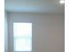 Bright bedroom with neutral walls and natural light from the window at 4830 Cazes Ave, North Port, FL 34287