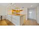 Bright kitchen with wood cabinetry, ideal for preparing delicious meals and enjoying casual dining at 601 Shreve St # 21C, Punta Gorda, FL 33950