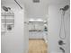 Bright bathroom boasts white tiles, shower, and double vanity at 601 Shreve St # 53C, Punta Gorda, FL 33950