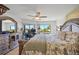 Comfortable primary bedroom suite featuring balcony access, and custom dresser with mirror at 601 Shreve St # 53C, Punta Gorda, FL 33950