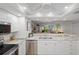 Bright, open kitchen boasts granite counters and modern stainless steel appliances at 601 Shreve St # 53C, Punta Gorda, FL 33950