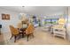 Open living room with tile flooring and comfortable seating leads to a screened lanai at 601 Shreve St # 53C, Punta Gorda, FL 33950