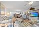 Comfortable living room with tile floors flows into dining area and kitchen at 601 Shreve St # 53C, Punta Gorda, FL 33950