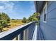 Enjoy outdoor living with views from this covered balcony with a wood floor and railings at 6421 Grove Blvd, Punta Gorda, FL 33982