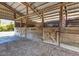 Barn interior with wooden stalls and ample space at 6421 Grove Blvd, Punta Gorda, FL 33982