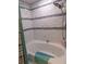 Bathroom features a soaking tub with tiled surround and a mounted shower head at 6421 Grove Blvd, Punta Gorda, FL 33982