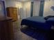 Cozy bedroom with a comfortable bed, matching dressers, and bright natural light at 6421 Grove Blvd, Punta Gorda, FL 33982