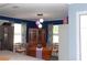 Cozy dining room featuring natural light, a vintage cabinet and table with decorative centerpieces at 6421 Grove Blvd, Punta Gorda, FL 33982
