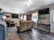 Open-concept living room with hardwood floors and modern decor at 6421 Grove Blvd, Punta Gorda, FL 33982