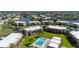 Aerial shot of the condos overlooking the central pool area, surrounded by well-cared for landscaping at 1080 Bal Harbor Blvd # 12C, Punta Gorda, FL 33950