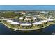 Beautiful aerial view of a waterfront condo complex with a community pool and surrounding landscaping at 1080 Bal Harbor Blvd # 12C, Punta Gorda, FL 33950