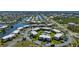 Beautiful aerial view of the condo community with the community pool and lush landscaping at 1080 Bal Harbor Blvd # 12C, Punta Gorda, FL 33950