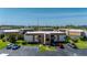Aerial view of a condo community with meticulously kept grounds, mature trees and convenient parking spaces at 1080 Bal Harbor Blvd # 12C, Punta Gorda, FL 33950