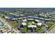 Expansive aerial view of the condo complex, surrounded by canal waterways and manicured greenery at 1080 Bal Harbor Blvd # 12C, Punta Gorda, FL 33950