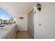 A well-lit balcony with outdoor decor and a view of palm trees and blue sky at 1080 Bal Harbor Blvd # 12C, Punta Gorda, FL 33950