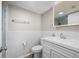 Bathroom with white marble style tile, a modern vanity and a toilet at 1080 Bal Harbor Blvd # 12C, Punta Gorda, FL 33950