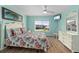 Light and airy bedroom featuring ocean-themed decor and a large window at 1080 Bal Harbor Blvd # 12C, Punta Gorda, FL 33950