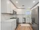 Updated kitchen featuring white cabinets, stainless steel appliances, and modern countertops at 1080 Bal Harbor Blvd # 12C, Punta Gorda, FL 33950