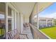 Screened lanai showcasing outdoor seating, a tile floor, and views of the community at 1080 Bal Harbor Blvd # 12C, Punta Gorda, FL 33950