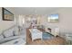 Spacious living room showcasing a comfortable sofa, flat-screen TV, and open floor plan at 1080 Bal Harbor Blvd # 12C, Punta Gorda, FL 33950