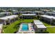 Overhead shot of the condos showcasing community pool, manicured landscaping, and lounge areas at 1080 Bal Harbor Blvd # 12C, Punta Gorda, FL 33950