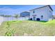 Spacious backyard with a white vinyl fence, lush grass, and well maintained lawn at 111 Rain Lily Ave, Spring Hill, FL 34609