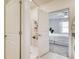 Modern bathroom featuring a stand up shower with white subway tile, with view into bedroom at 111 Rain Lily Ave, Spring Hill, FL 34609