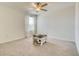 Bedroom featuring a ceiling fan, neutral walls, carpet flooring and a window for natural light at 111 Rain Lily Ave, Spring Hill, FL 34609